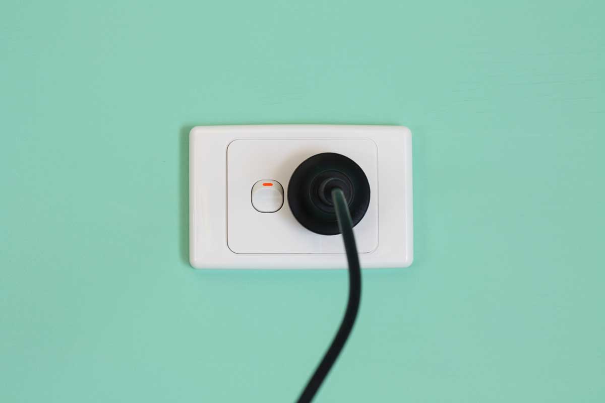 Australian electric power wall outlet and power cord.